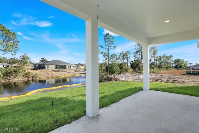 view of patio featuring a water view