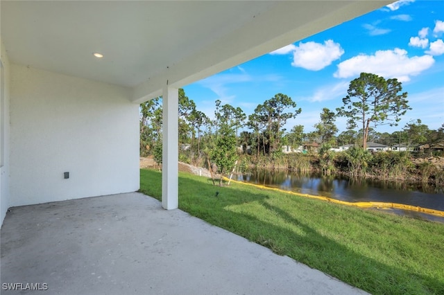 view of patio featuring a water view