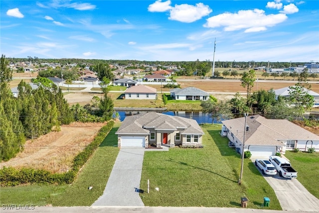 birds eye view of property with a water view