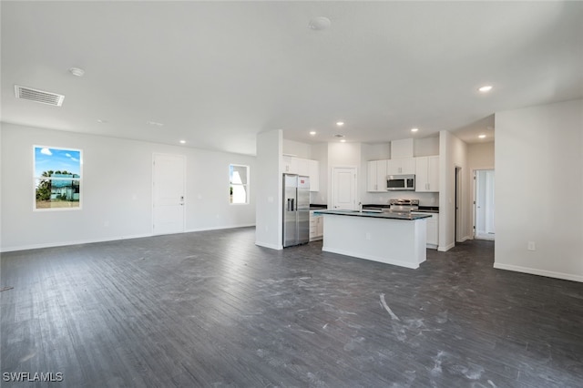 kitchen featuring white cabinets, appliances with stainless steel finishes, and a center island