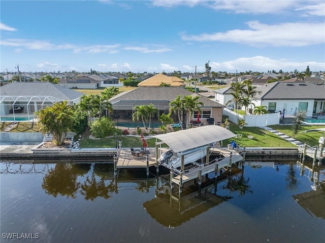 view of dock featuring a yard and a water view