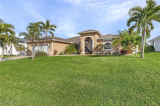 view of front facade featuring a garage and a front lawn