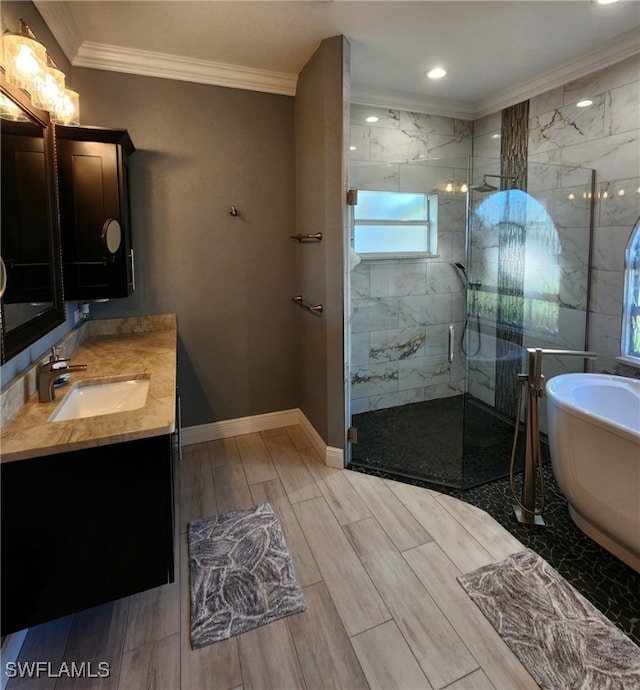 bathroom featuring plus walk in shower, vanity, and ornamental molding