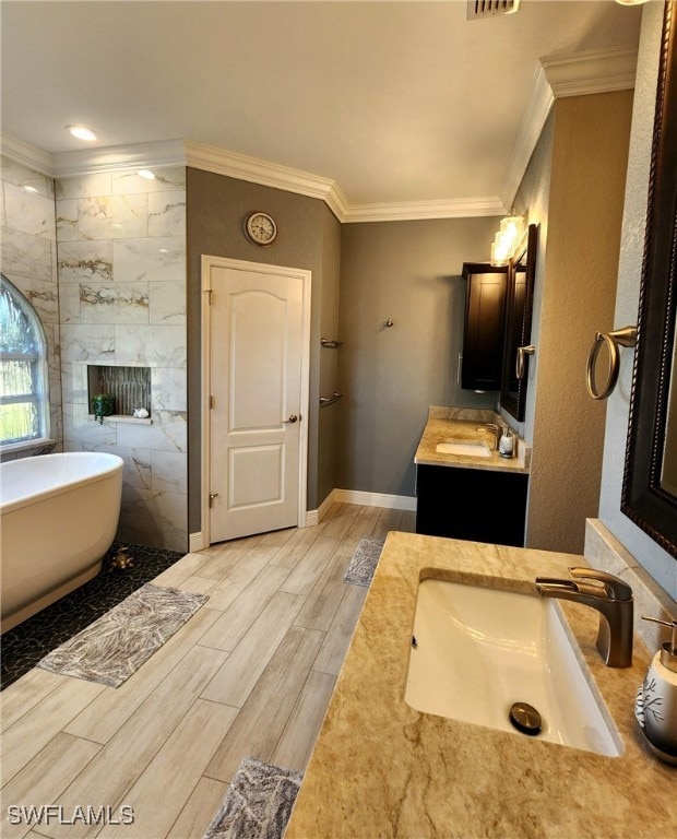 bathroom featuring a bath, crown molding, wood-type flooring, vanity, and tile walls