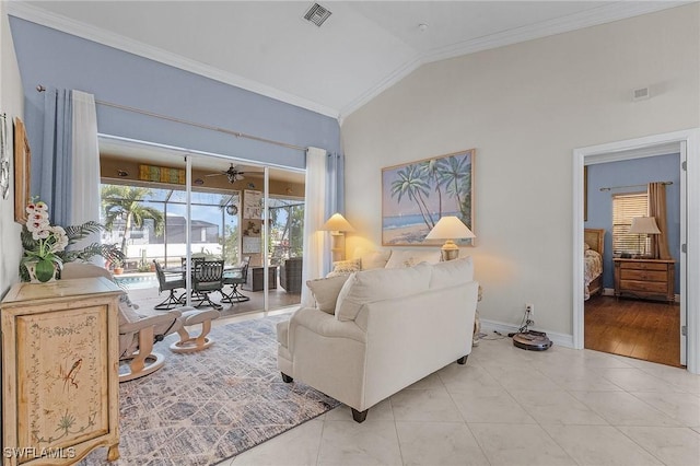 living room featuring light hardwood / wood-style floors, vaulted ceiling, ceiling fan, and crown molding