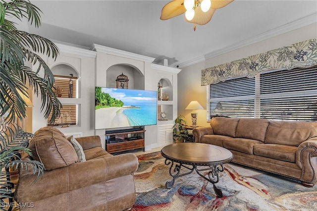 living room featuring ceiling fan and crown molding