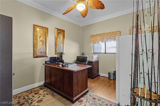 office with light wood-type flooring, ceiling fan, and crown molding