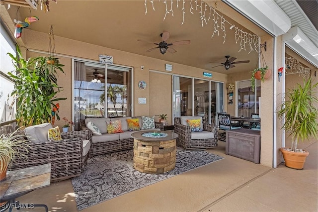 view of patio featuring an outdoor living space with a fire pit