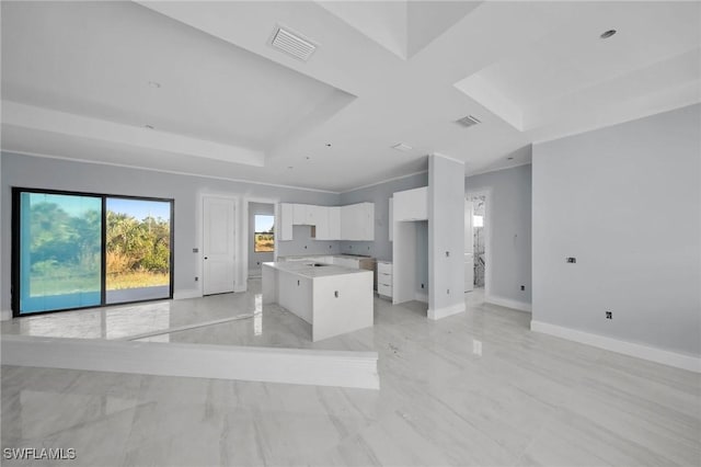 kitchen featuring a center island and white cabinets