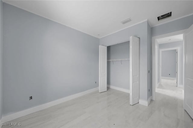 unfurnished bedroom featuring a closet