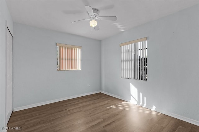 unfurnished room with ceiling fan and wood-type flooring