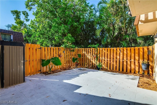 view of patio featuring a gate and fence