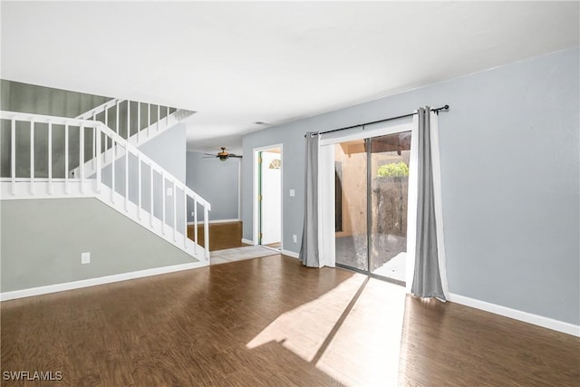 unfurnished room featuring hardwood / wood-style floors and ceiling fan