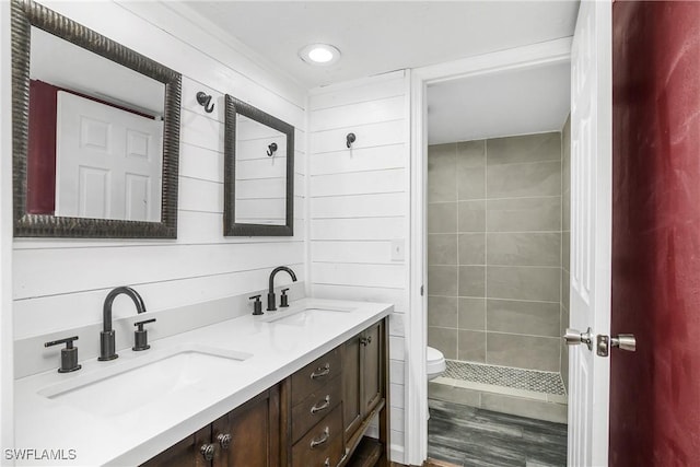 bathroom featuring toilet, vanity, and hardwood / wood-style flooring