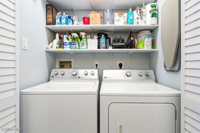 laundry area with laundry area and washer and clothes dryer