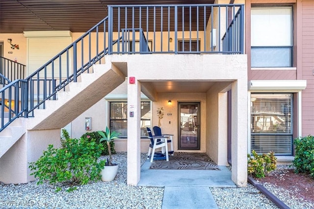 doorway to property with stucco siding