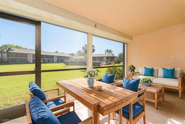 sunroom / solarium featuring an outdoor hangout area