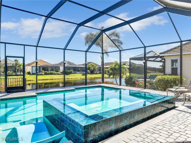 view of swimming pool featuring a lanai, a water view, and a patio