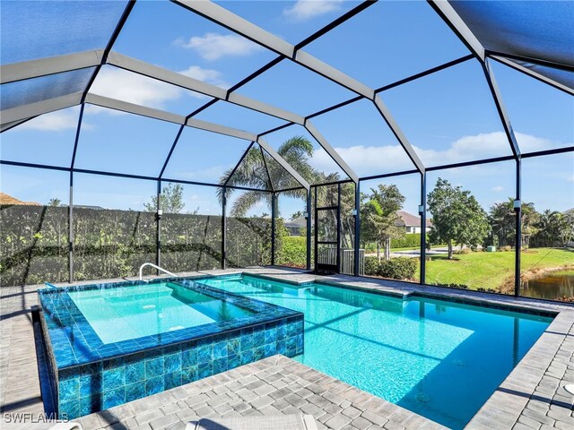 view of pool with glass enclosure