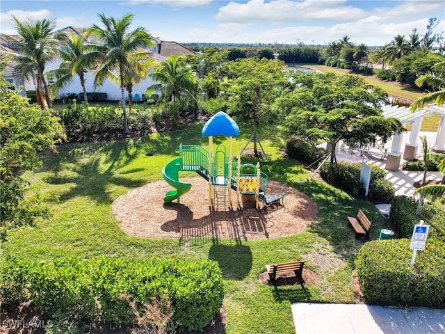 view of jungle gym featuring a lawn