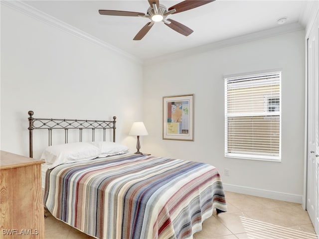 bedroom featuring ceiling fan, light tile patterned floors, and ornamental molding