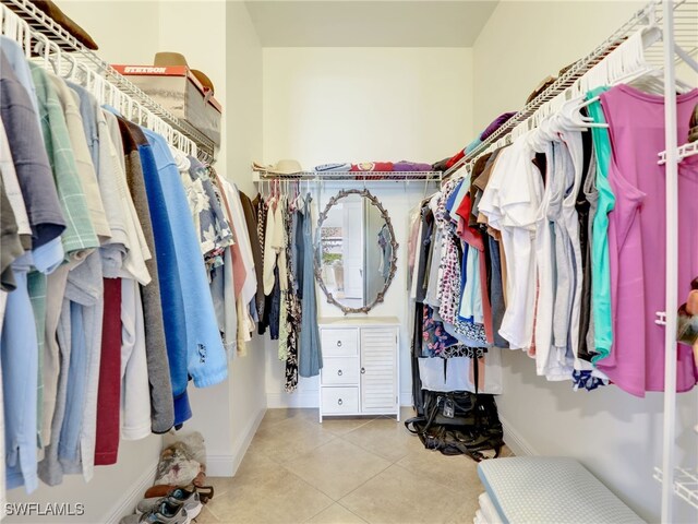 spacious closet featuring light tile patterned floors