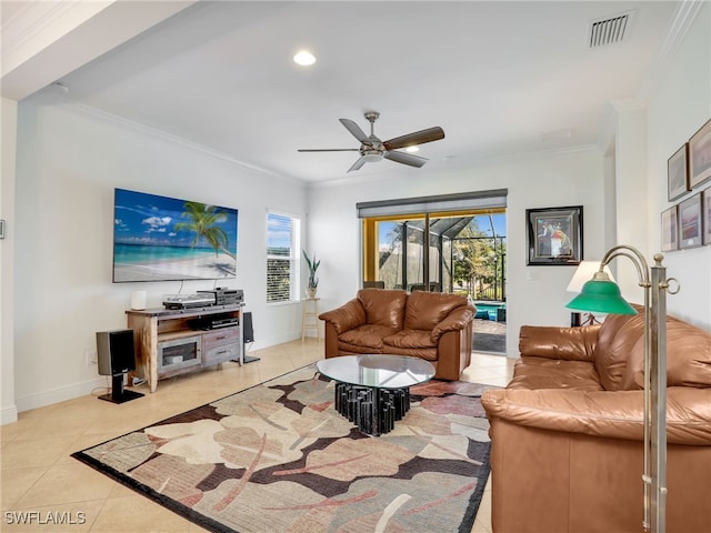 living room featuring ceiling fan, crown molding, and light tile patterned flooring