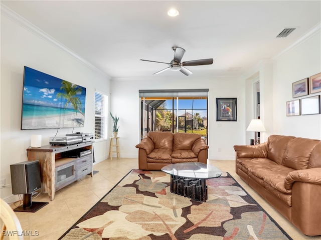 living room featuring ceiling fan, crown molding, and light tile patterned flooring