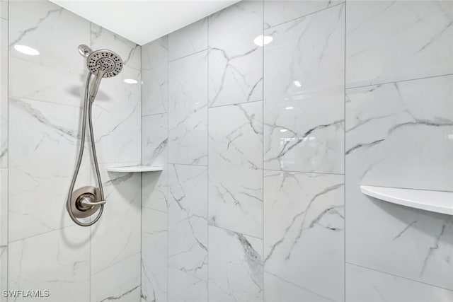 interior space with tiled shower