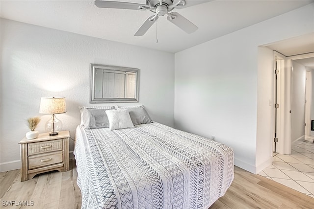 bedroom featuring light hardwood / wood-style flooring and ceiling fan