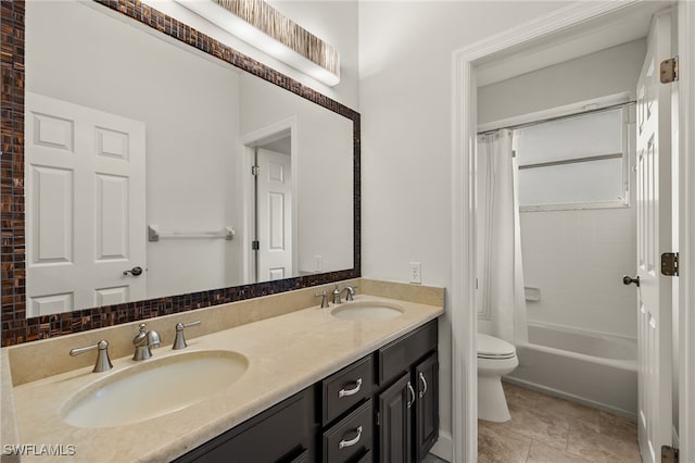 full bathroom featuring tile patterned floors, vanity, toilet, and shower / bath combo with shower curtain