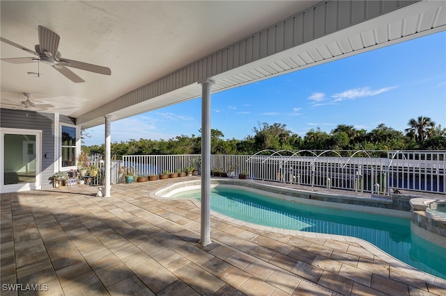 view of pool featuring a hot tub, ceiling fan, and a patio area