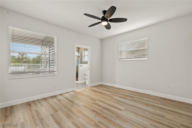 spare room with light hardwood / wood-style flooring and ceiling fan