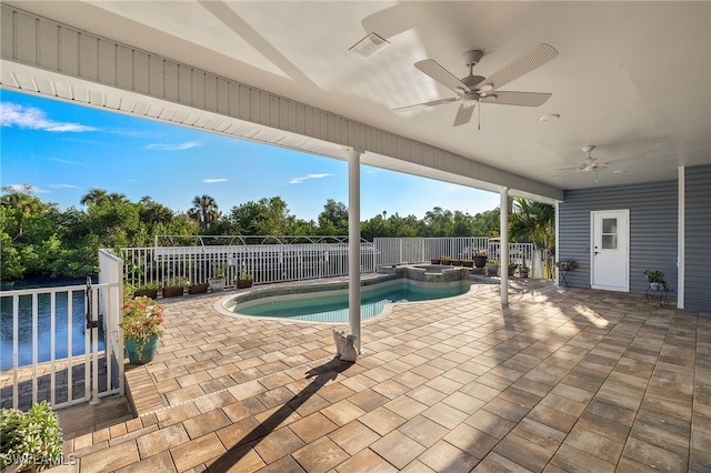 view of swimming pool with a patio area, ceiling fan, and an in ground hot tub