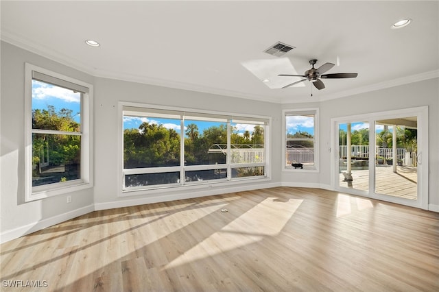 unfurnished sunroom with ceiling fan