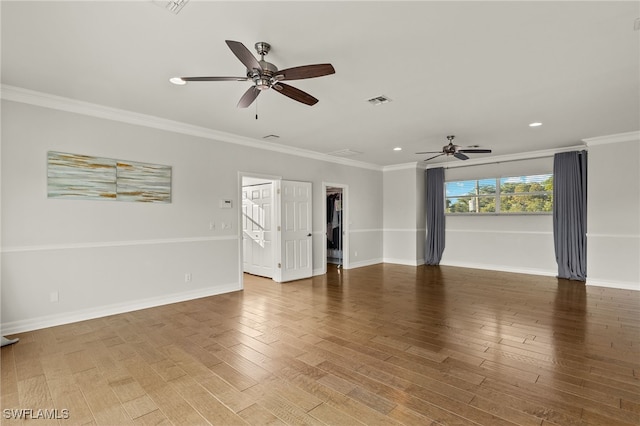 unfurnished room with hardwood / wood-style floors, ceiling fan, and crown molding