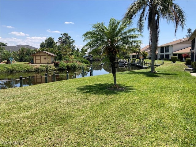 view of yard featuring a water and mountain view