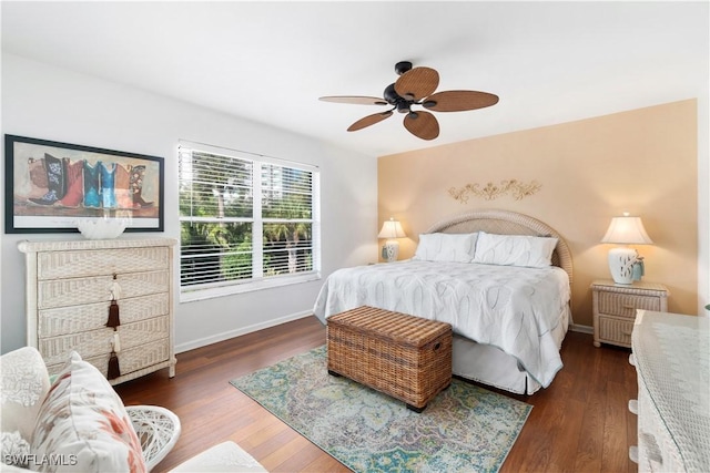 bedroom featuring dark hardwood / wood-style flooring and ceiling fan