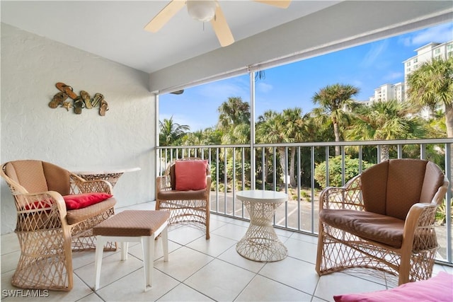 sunroom / solarium featuring ceiling fan