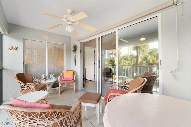 sunroom / solarium featuring ceiling fan