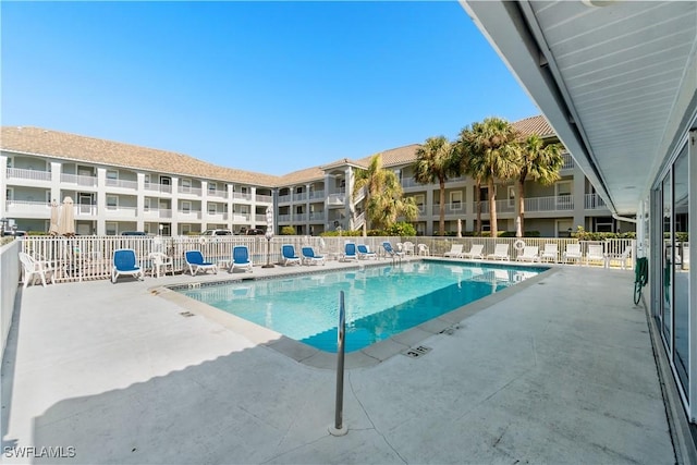 view of swimming pool featuring a patio