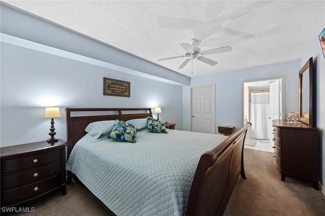 carpeted bedroom featuring ceiling fan and a textured ceiling