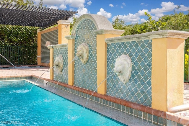 view of pool with pool water feature