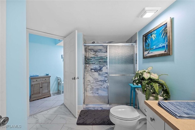 bathroom with vanity, toilet, and walk in shower