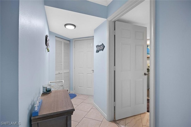 corridor with light tile patterned flooring