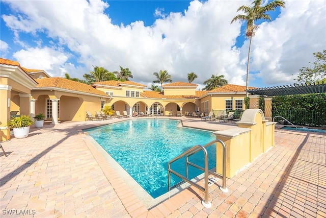 view of swimming pool featuring a patio