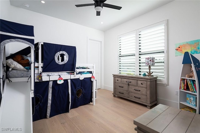 bedroom featuring ceiling fan and light hardwood / wood-style floors