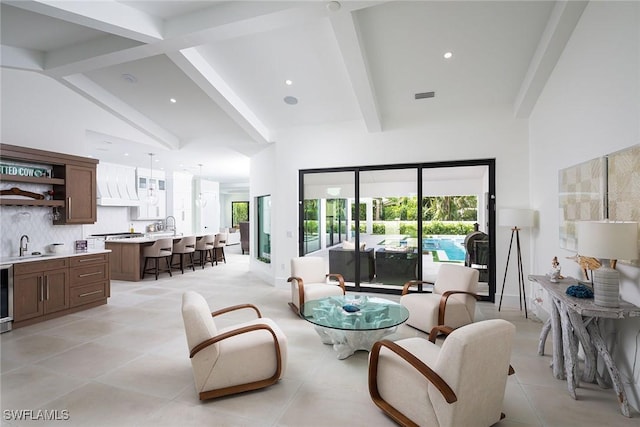 living room with light tile patterned floors, vaulted ceiling with beams, beverage cooler, and sink