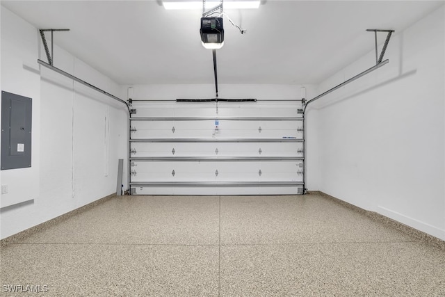 garage with a garage door opener and electric panel