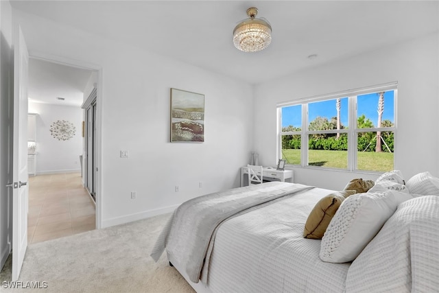 bedroom featuring light carpet